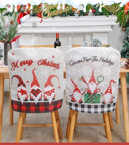 Detail of linen Christmas chair covers with gnome design and plaid patterns