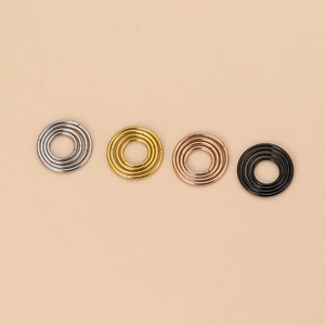 Detail view of 20g stainless steel lip and nose rings in silver, gold, rose gold and black