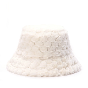 Detailed texture of thick white plush faux fur on a warm winter bucket hat for women