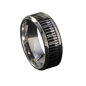 Polished stainless steel ring featuring a minimalist black and white piano key pattern
