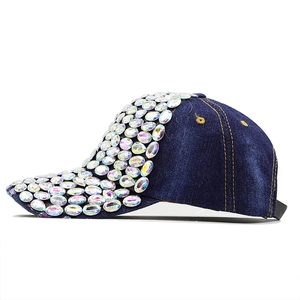 Detail of dark blue denim baseball cap featuring colorful rhinestone embellishments
