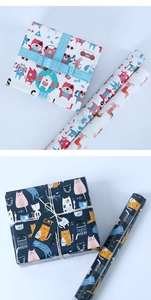 Detailed view of cat and dog themed gift wrapping paper with ribbons and decorative tags