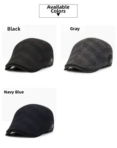 Three men's vintage ivy caps in black, grey, and navy with side metal buckle detail