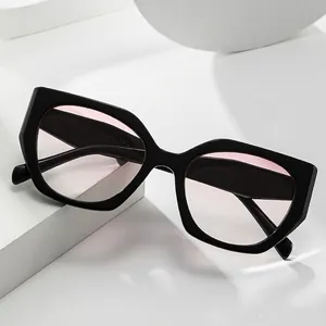 Modern thick black geometric cat-eye sunglasses with translucent light pink tinted lenses