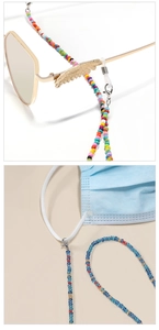 Detail of colorful beads lanyard with golden feather charm for glasses and face masks