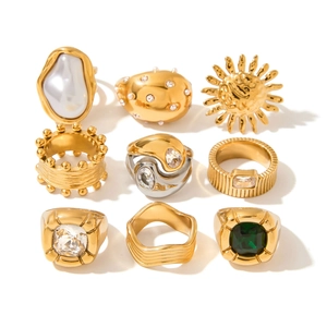 Set of luxury stainless steel gold and silver rings with pearls and green gemstones