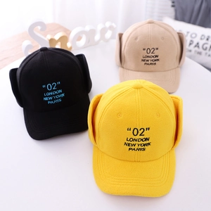 Three warm fleece pilot trapper hats in yellow black and beige with 02 London embroidery