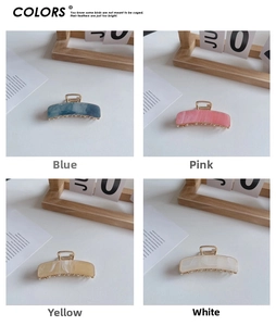 Detail view of rectangular acetate hair claws in blue pink yellow and white colors