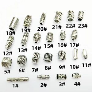 Collection of 23 vintage Tibetan silver spacer beads with embossed ethnic patterns