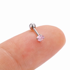 Detailed macro view of a silver helix stud with pink zircon held on a fingertip