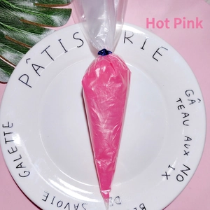 Close-up of pink pearlescent cream glue in a piping bag for DIY phone case crafts