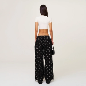 Women's streetwear set with white crop top and black cross print tie-dye cargo pants