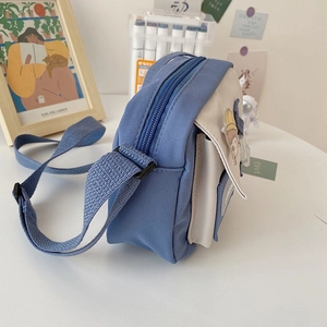 Blue and beige nylon crossbody messenger bag with cartoon badges for women
