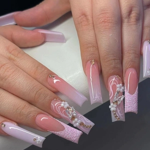 Long ombre pink and white press-on nails with 3D butterflies, flowers and rhinestones