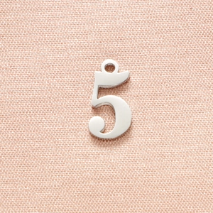 Detailed close-up of polished silver number 5 pendant charm for DIY jewelry making