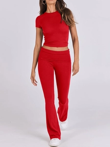 Detail of red two-piece lounge set showing soft elastic fabric and casual fit