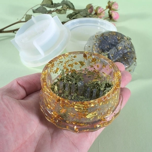 Detail view of round DIY silicone mold for resin herb grinder with gold foil inlay