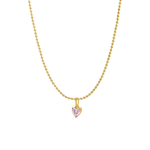Detail of pink heart zircon pendant on golden bead chain with polished finish