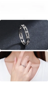 Macro view of a 925 sterling silver chain ring with clear zircons and model display