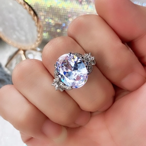 Detailed view of the large oval cut cubic zirconia center stone with multi-prong setting
