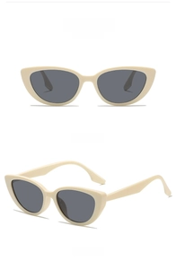 Detail view of beige cat eye sunglasses with grey lenses in front and side perspectives