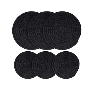 Detailed macro view of 6-piece black cotton rope woven round coasters set texture