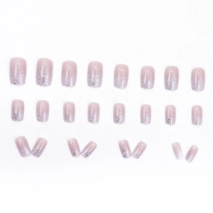 24-piece short oval pink ombre press-on nails with silver glitter accents on tips
