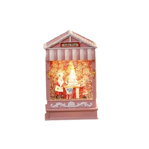 Pink Christmas cake shop music box with warm LED lighting and swirling snow glitter
