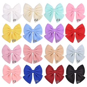 Macro display of bow hair clips in 16 macaron colors with chiffon fabric texture