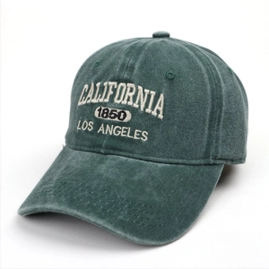 Detail of dark green washed denim baseball cap with California 1850 embroidery