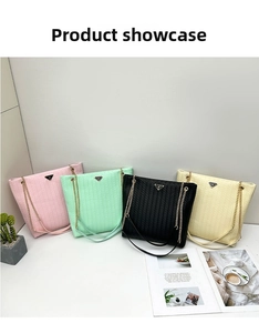 Detail showing woven texture and gold chain straps on stylish tote bags in four colors