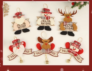 Detail of fabric Christmas ornaments featuring Santa, snowman and reindeer with metal bells