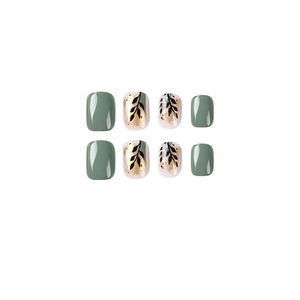 Elegant short press-on nails with sage green and gold foil leaf patterns on white.