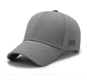 Close-up of gray baseball cap featuring NS 3D embroidery and breathable textured fabric