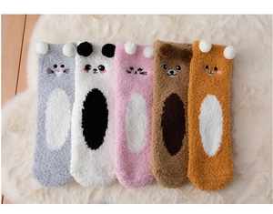 Detail of five pairs thick coral fleece socks with cute 3D cartoon animal designs