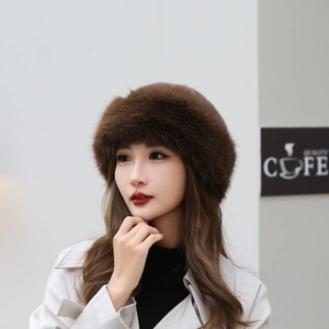 Elegant dark brown faux fur winter beret hat for women showing cozy warm plush texture