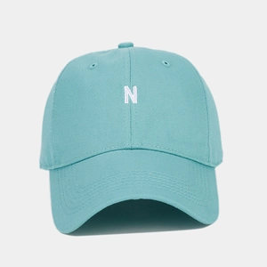 Detail of the N letter embroidery on this light blue-green cotton baseball cap