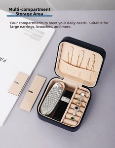Detail view of the 4-compartment jewelry box with necklace hooks and ring slots