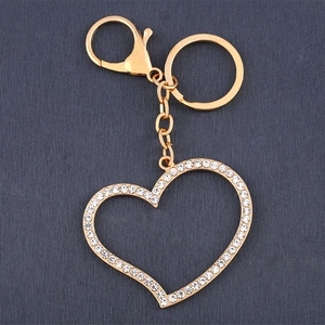Golden hollow heart keychain with sparkling white rhinestones and secure lobster clasp charm