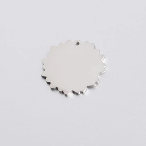 Macro detail of silver mirror polished stainless steel flower pendant charm with top hole