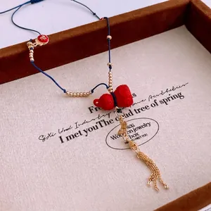 Chinese cinnabar gourd pendant necklace with golden tassels and ethnic red beads