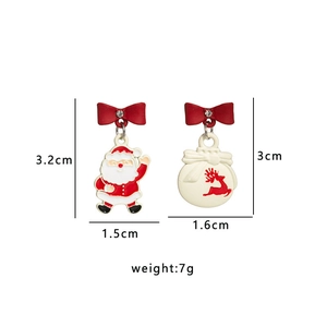 Detail view of festive asymmetric Christmas earrings with Santa and bauble charms