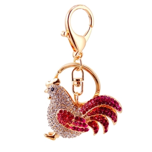 Sparkling rooster rhinestone keychain with gold finish and red accents for handbags