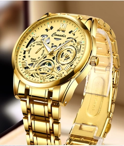 Detailed macro view of the gold hollow mechanical dial and luminous hands of the watch