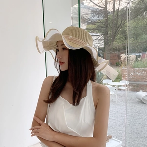 Elegant khaki straw sun hat with large brim, white mesh trim and pearl accents