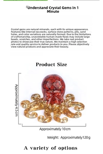 Detail view of octopus resin ornament with red crystal stone and gold foil elements