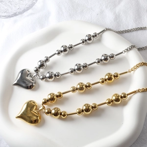 Polished stainless steel heart pendant necklace set in gold and silver finish