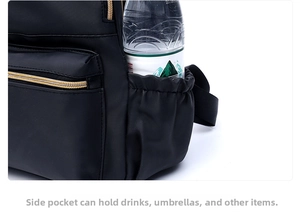 Detail of black oxford backpack side pocket holding a water bottle for storage display