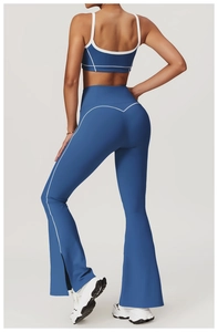 Detail view of sapphire blue yoga set with contrast piping and side slit flare pants
