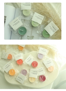 Close-up of assorted colorful tealight candles in individual plastic packaging on a tray